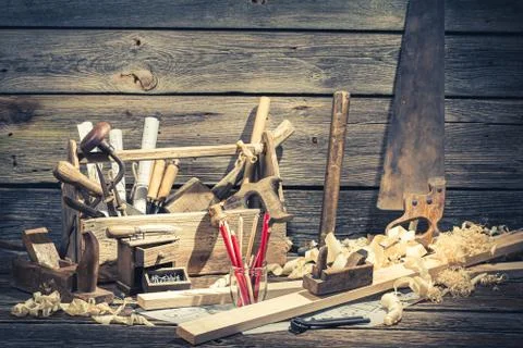 Old carpentry workbench and drawing workshop in rustic wooden shed Stock-Fotos