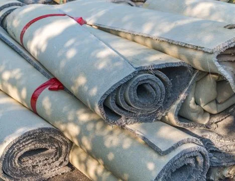 Old carpet rolls Stock Photos