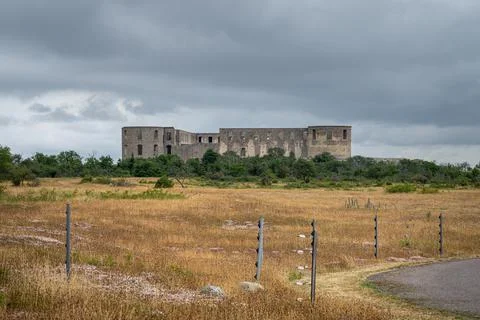 An old castle with a dramatic sky in the background Stock Photos