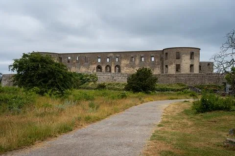 An old castle with a dramatic sky in the background Stock Photos