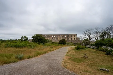 An old castle with a dramatic sky in the background Stock Photos