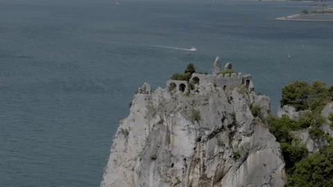 Old Castle of Duino on the Adriatic cliffs Stockbeeldmateriaal 339729755