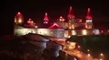 Old castle at night, stone fortress in Kamianets-Podilskyi city, western Ukraine HD Footage