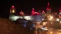 Old castle at night, stone fortress in Kamianets-Podilskyi city, western Ukraine HD Footage