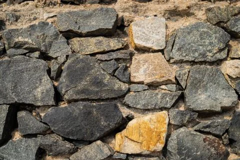 Old castle stone wall texture background in perspective Stock Photos