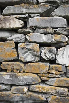 Old castle stone wall texture background.  Vertical shot , close up view Stock Photos