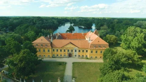 Old castle surrounded by forests and a river. Historical medieval building Stock Footage 152784758