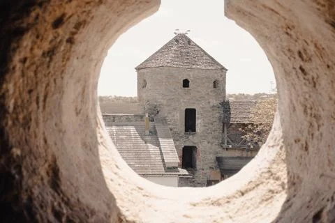 Old castle tower, view through the loophole Stock Photos