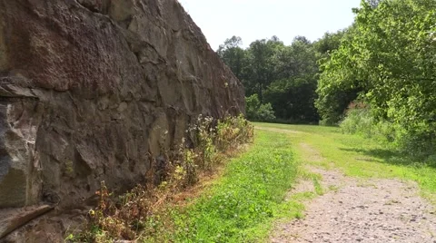 Old Castle Wall with Pathway and Greenery Stock Footage 51354240