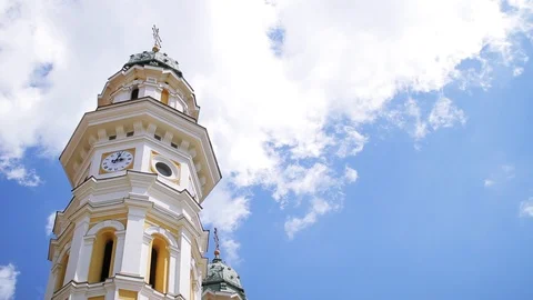 Old cathedral tower with blue cloudless sky on the background.Symbol of the city Stock Footage 99603592