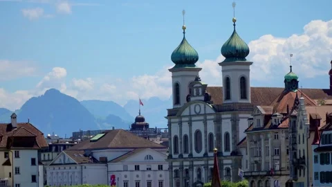 An old cathedral with two towers, surrounded by many old buildings Video stock 313327971