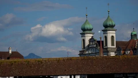 An old cathedral with two towers, surrounded by many old buildings Video stock 313328165