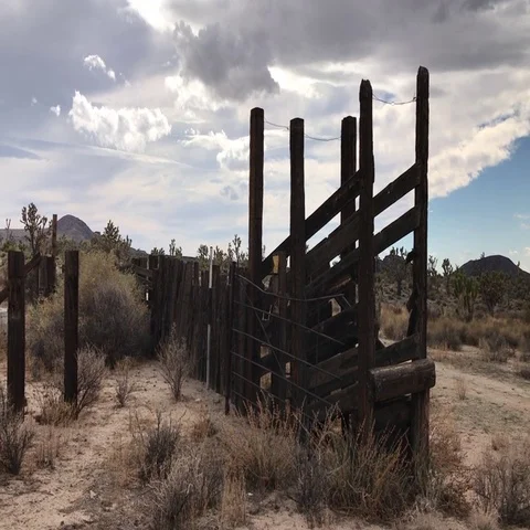 Old cattle pen and windmill Stock Footage 69291589