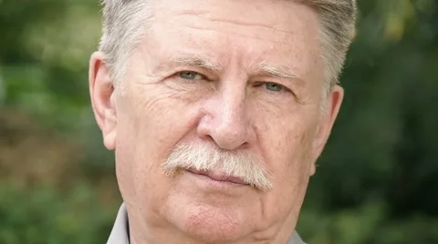 Old Caucasian Man Looking At Camera Stock-Footage 55909853