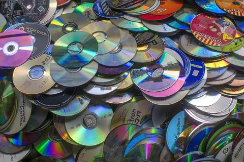 Old CDs collected for recycling in a container Bavaria Germany Europe Stock Photos