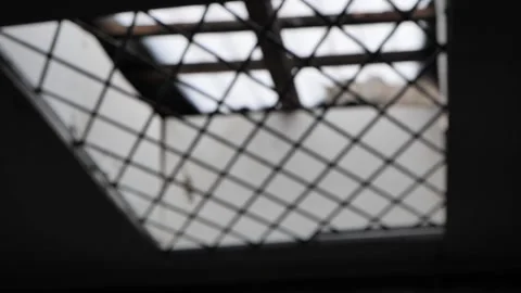 Old ceiling iron bar filled by dim light with the soft focus blurr to focus Video stock 172393224