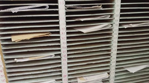 Old cells for storing documents in an archive, ensuring organize placement .. Stock Footage 312621145