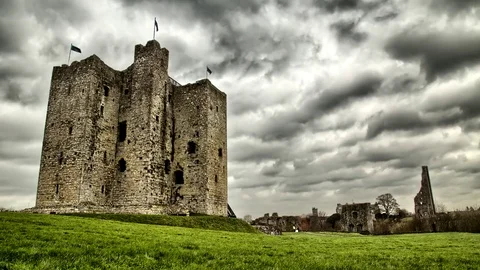 Old celtic castle ruins with clouds timelapse Stock Footage 71731499