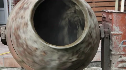 Old Cement Mixer Machine mixing concrete with sound Stock Footage 221340551