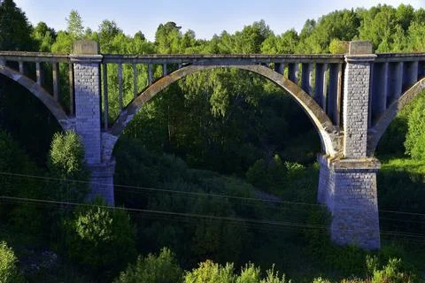 An old century-old railway viaduct across the Iren River near the Bartym stat Stock Photos