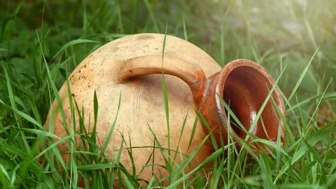 Old Ceramic Clay Pitcher Lying In Grass (2) Stock Footage 127719016