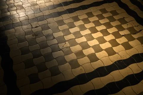 Old ceramic floor with wave pattern and vintage texture in moody sunlight, .. 스톡 사진