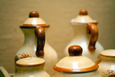 Old ceramic jugs in front of a wall Stock Photos