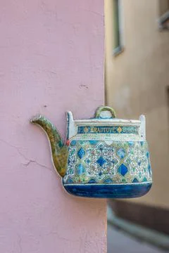 Old ceramic teapot embedded in a painted plastered wall Stock Photos