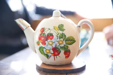 Old ceramic teapot on white background . Stack of antique ceramic teapot sele Stock Photos