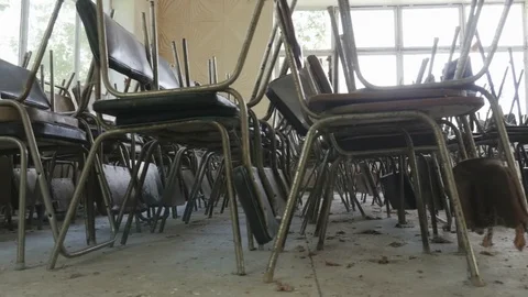 Old chairs placed in rows in an abandoned restaurant, public dining room Stock Footage 81803382