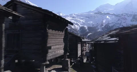 Old chalets in Saas Fee - Aerial 4K - Phantom 4 PRO Stock Footage 102341453