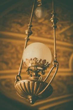 Old chandelier hanging from the ceiling Stock Photos