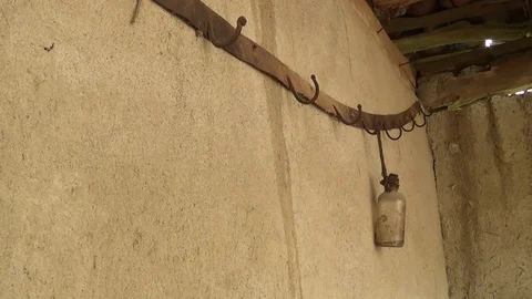 An old chef and a hatched bottle from the inside of an old and abandoned hous Vídeo Stock 111196334