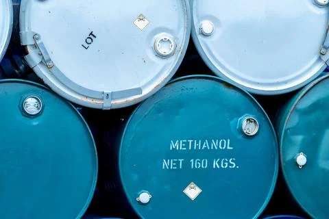 Old chemical barrels. Stack of blue methanol or methyl alcohol drum. Steel ch Foto stock