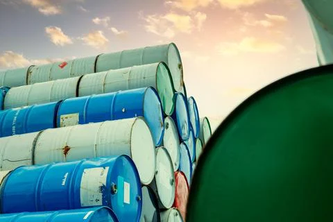 Old chemical barrels stack. Red, green, and blue chemical drum. Steel tank of Foto stock