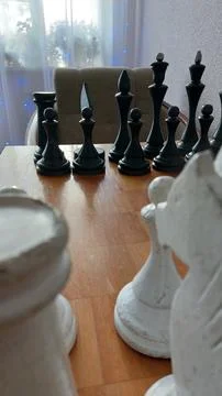 Old chess on an old chessboard Stock Photos