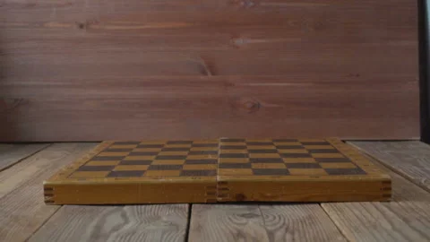 Old chess slowly falling on the chessboard Stock-Footage 95180602