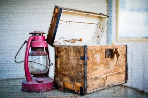 Old Chest And Lantern On A Table Stock Photos