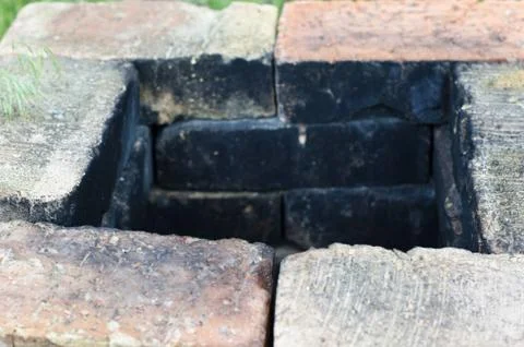 Old chimney stack ruin in an old walled garden Foto stock