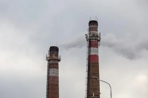 Old chimneys on sky background Stock Photos