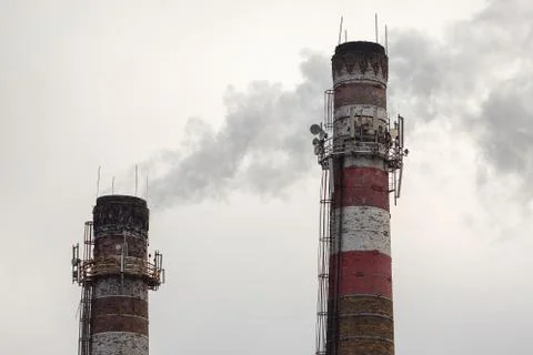 Old chimneys on sky background Stock Photos