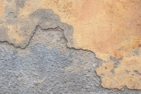 Old chipped plaster on the concrete wall, texture background Stock Photos