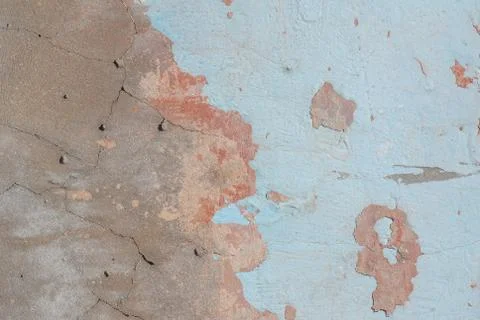 Old chipped plaster on the concrete wall, background texture Stock Photos