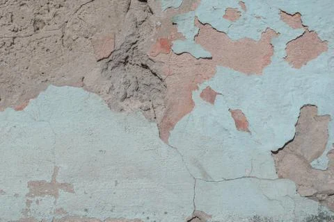 Old chipped plaster on the concrete wall, background texture Stock Photos