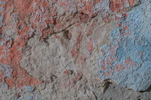 Old chipped plaster on the concrete wall, chipped paint, texture, background Stock Photos