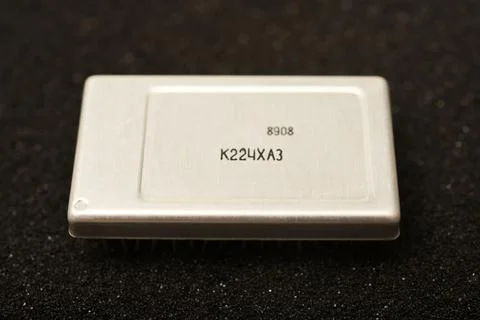 Old chips on a black background. Microchips on foam rubber. Microcircuits. Stock Photos