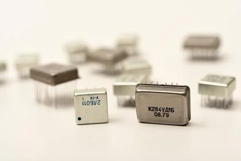 Old chips on a white background. Different electronic chips. Microcircuits .. Stock Photos