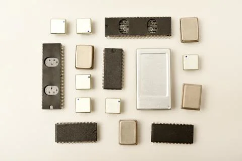 Old chips on a white background. Electronic components. Processors in metal.. Stock Photos