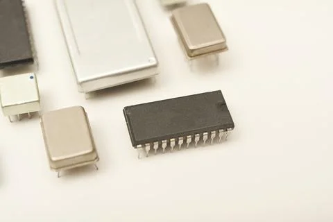 Old chips on a white background. Electronic components. Processors in metal.. Stock Photos
