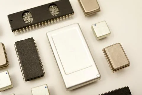 Old chips on a white background. Electronic components. Processors in metal.. Stock Photos